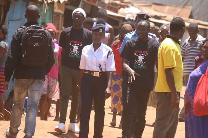 Police officer walking with community members